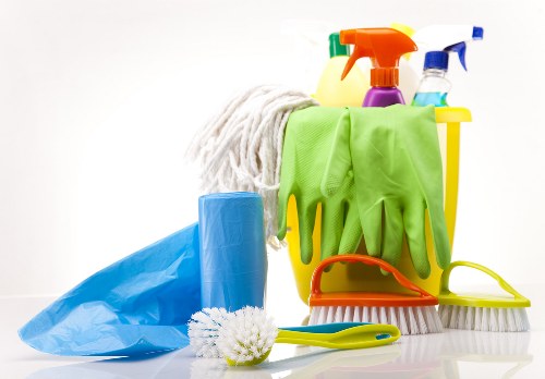 End of tenancy cleaners working safely in a rental property