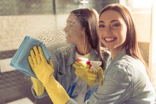 End-of-tenancy office cleaners polishing glass and floors