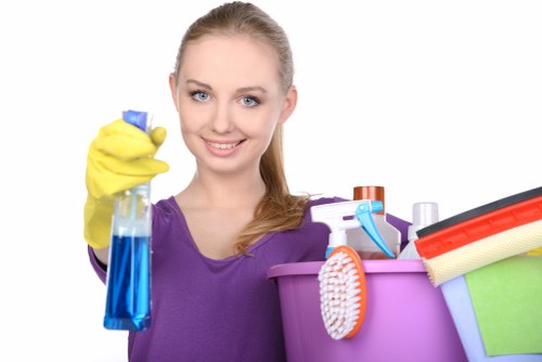 End of tenancy cleaner using protective equipment during cleaning