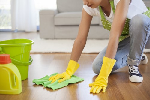 Cleaner wearing PPE while completing tenancy cleaning tasks